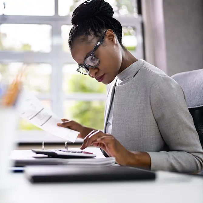 Woman working at her desk.