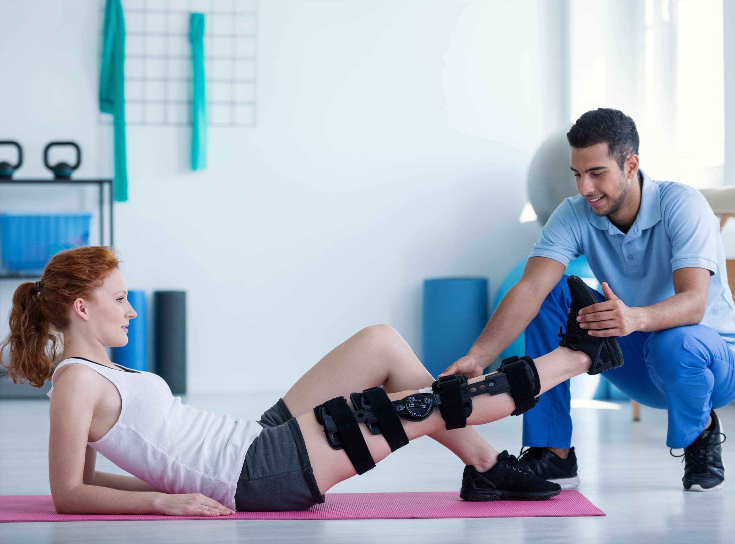 Althetico Case Study Hero - Woman With Leg Injury on Mat and With Doctor During Treatment